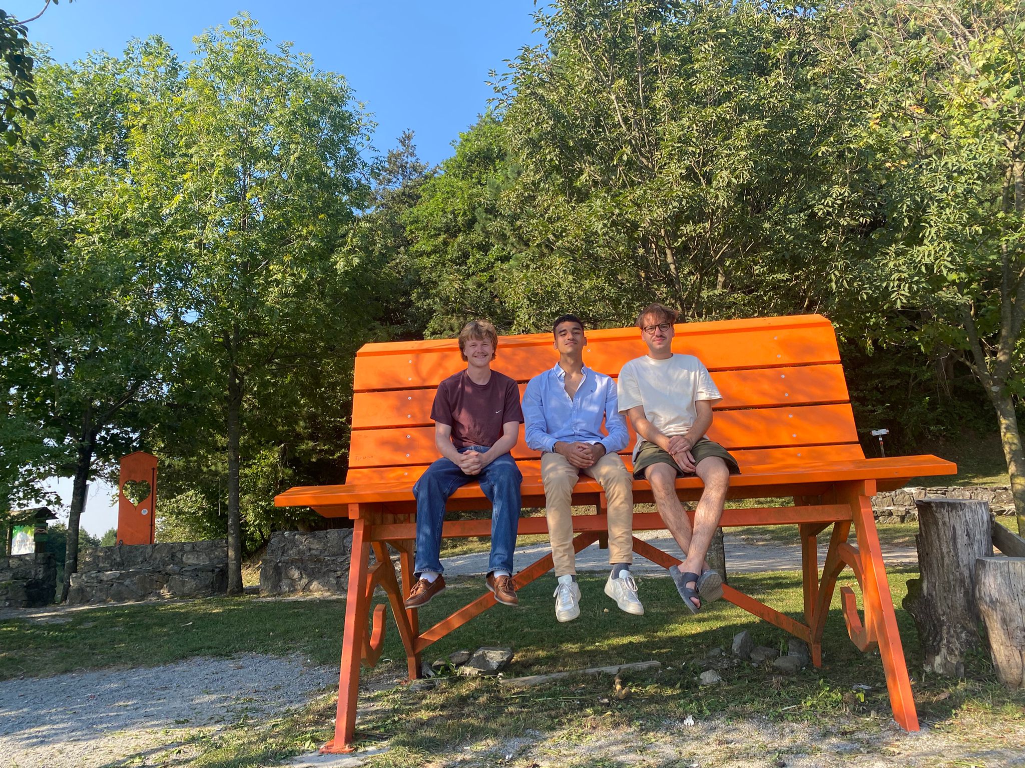 Dries Albert with friends on a giant bench